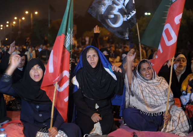 protesters chant slogans during a protest against the killing of their community members in an overnight bombing in karachi on january 22 2014 photo afp protesters chant slogans during a protest against the killing of their community members in an overnight bombing in karachi on january 22 2014 photo afp