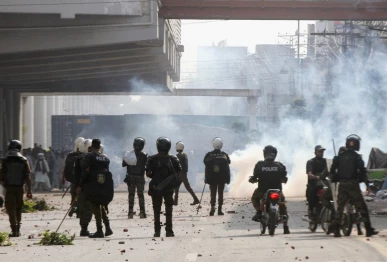 police officers stand as they use tear gas to disperse supporters of tlp during a solidarity march for gaza in lahore on october 10 2025 photo reuters