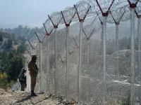 pakistani soldiers keep vigil next to newly fenced border fencing along with afghan s paktika province border in angoor adda in south waziristan photo afp