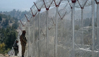 pakistani soldiers keep vigil next to newly fenced border fencing along with afghan s paktika province border in angoor adda in south waziristan photo afp