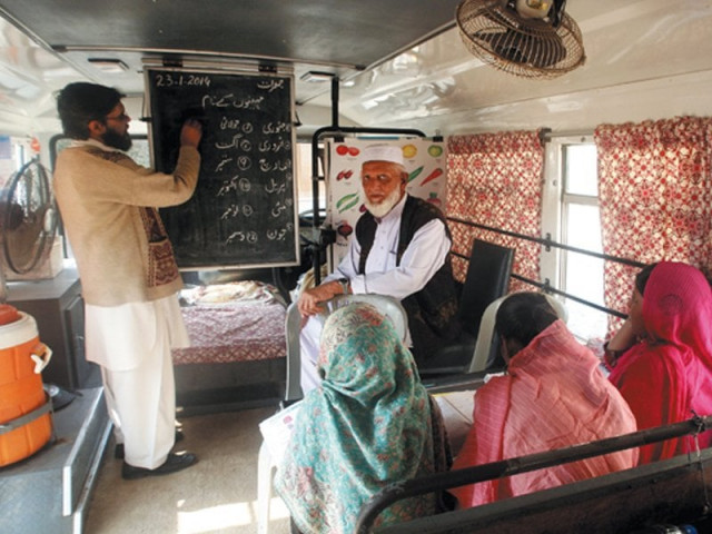 students are taught basics of reading and writing by a teacher and a teaching assistant photos athar khan express students are taught basics of reading and writing by a teacher and a teaching assistant photos athar khan express