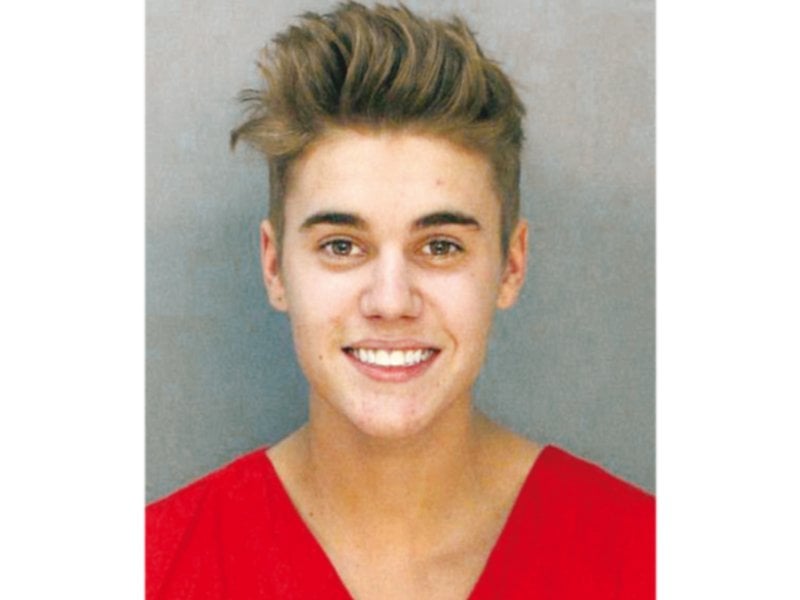 the pop star smiled for the police mug shot post arrest photo file