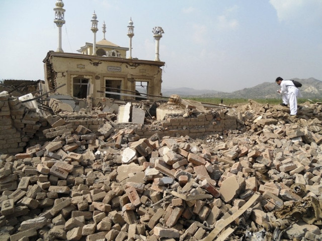 a member of the media films at the site of a bomb attack in the spin tal region of hangu district bordering north waziristan in october 3 2013 photo afp a member of the media films at the site of a bomb attack in the spin tal region of hangu district bordering north waziristan in october 3 2013 photo afp