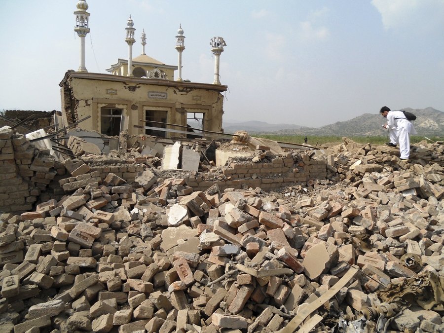 a member of the media films at the site of a bomb attack in the spin tal region of hangu district bordering north waziristan in october 3 2013 photo afp