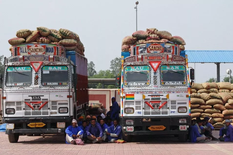 in this file photo indian porters sit under the shade of goods trucks as they stage a sit in protest at the integrated check post icp at the india pakistan border in wagah on april 23 2013 photo afp in this file photo indian porters sit under the shade of goods trucks as they stage a sit in protest at the integrated check post icp at the india pakistan border in wagah on april 23 2013 photo afp