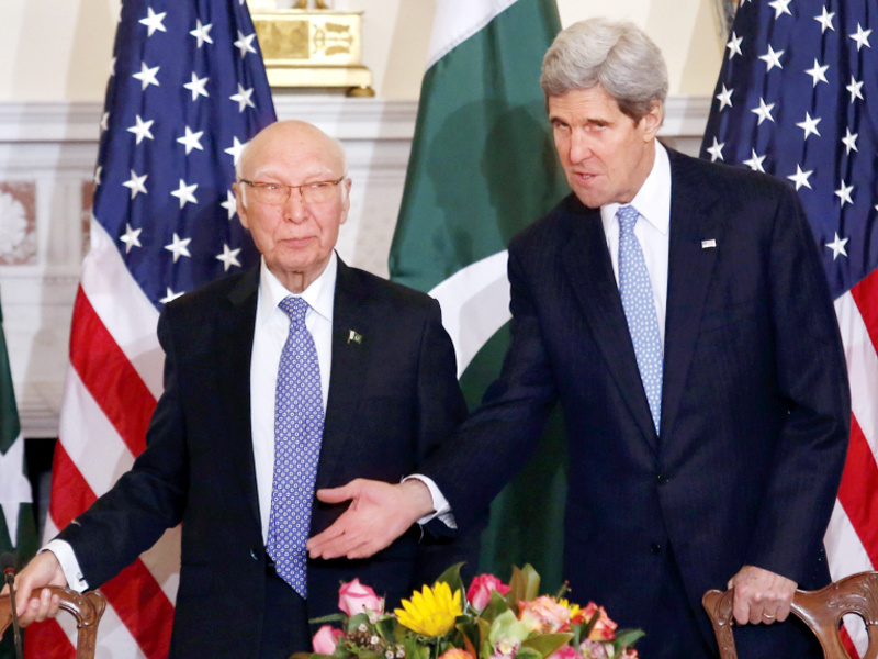 john kerry gestures sartaj aziz ahead of the press conference photo reuters