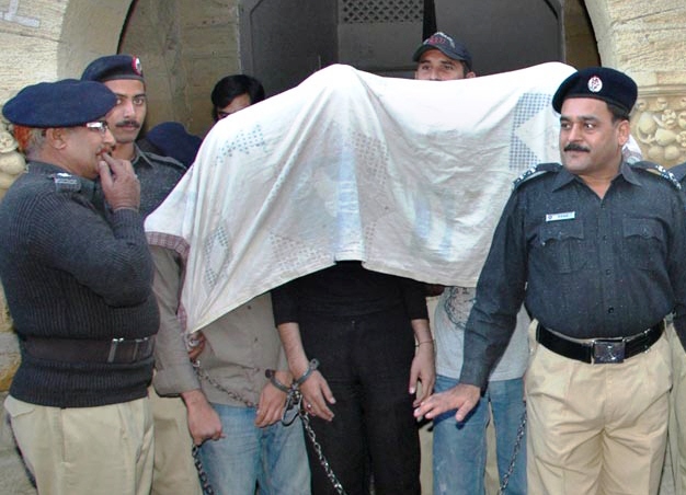 a file photo of karachi police with arrested suspects photo app