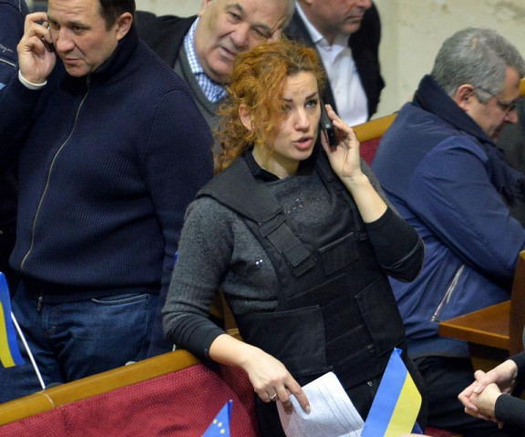 ukrainian opposition deputy lesya orobyets wears a bulletproof vest during an extraordinary parliamentary session in kiev on january 28 2014 photo afp ukrainian opposition deputy lesya orobyets wears a bulletproof vest during an extraordinary parliamentary session in kiev on january 28 2014 photo afp