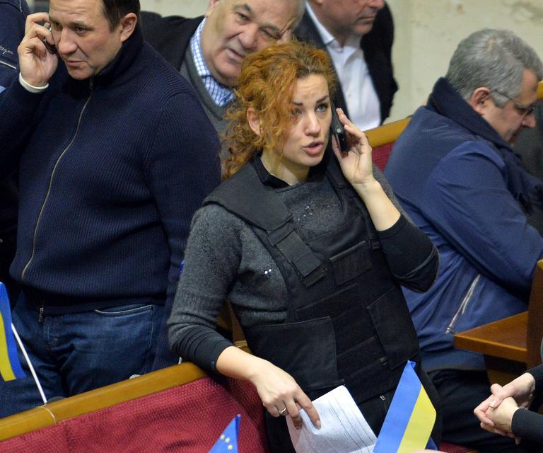 ukrainian opposition deputy lesya orobyets wears a bulletproof vest during an extraordinary parliamentary session in kiev on january 28 2014 photo afp