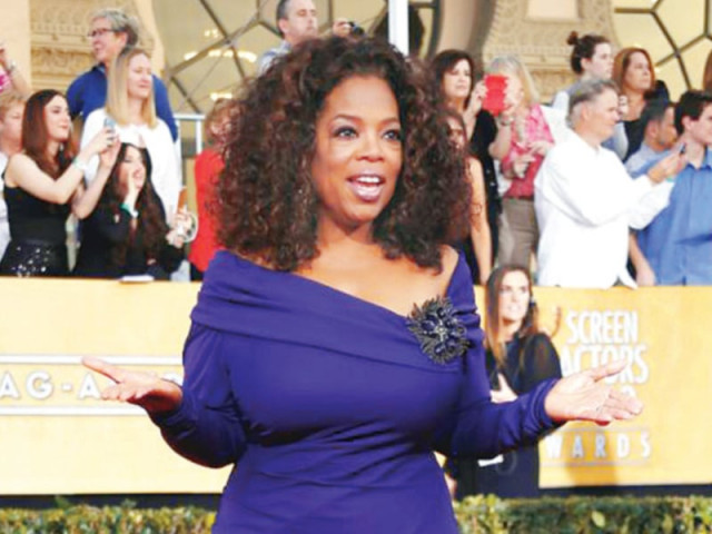 winfrey arrives at the 20th annual screen actors guild awards photo file winfrey arrives at the 20th annual screen actors guild awards photo file