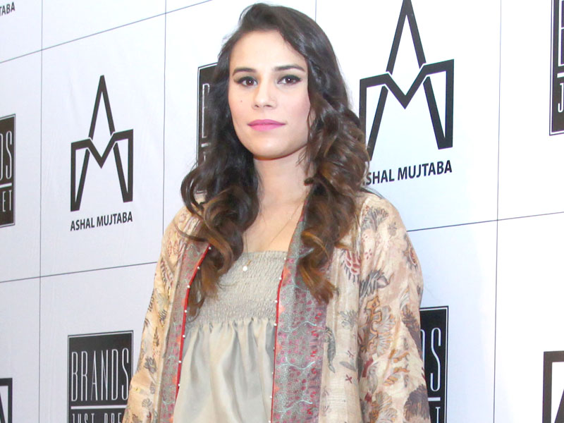zoe pulls of this ensemble with elegance and style
