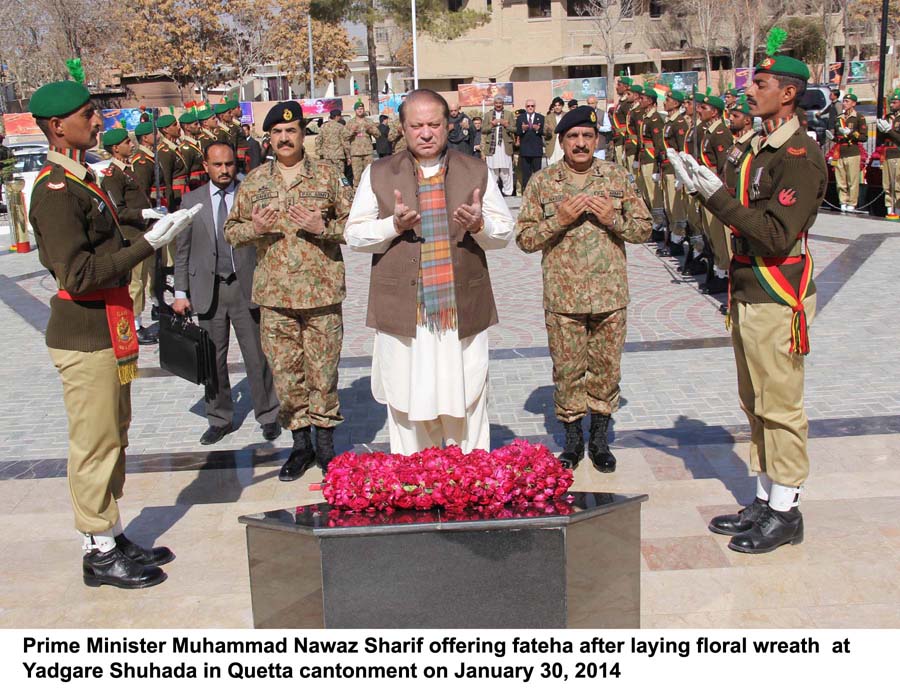 prime minister offering fateha after laying floral wreath at yadgar e shuhada in quetta cantonment on january 30 2014 photo pid