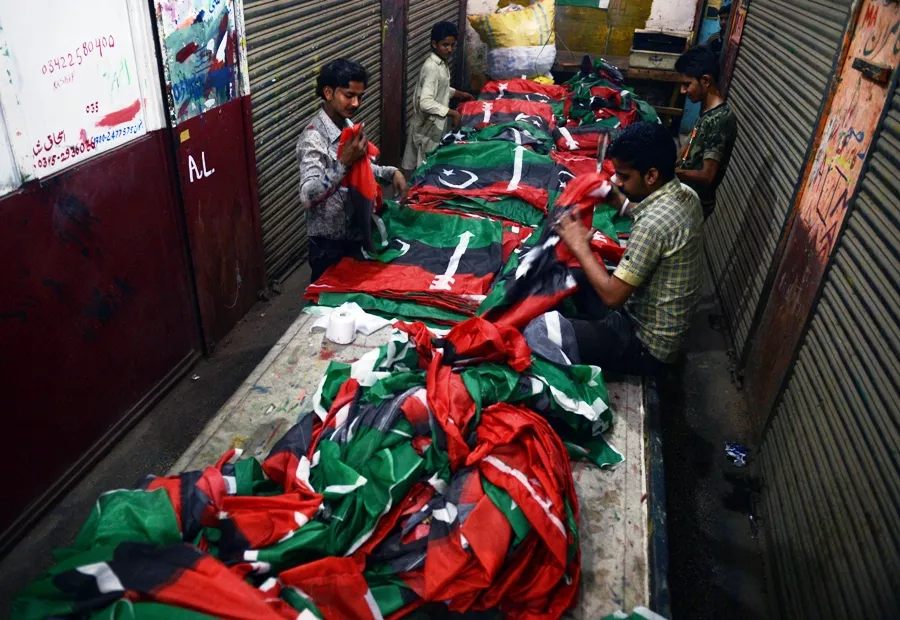 workers prepare campaign flags for pakistan peoples party ppp ahead of the forthcoming general election in karachi on april 16 2013 photo afp workers prepare campaign flags for pakistan peoples party ppp ahead of the forthcoming general election in karachi on april 16 2013 photo afp