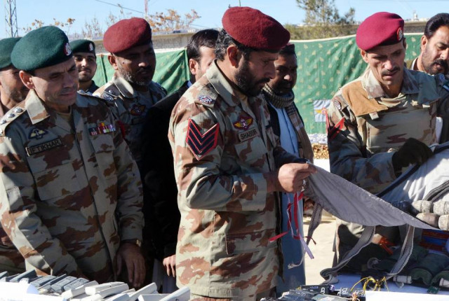 a file photo of fc personnel with weapons and ammunition seized in quetta on december 28 2013 photo afp a file photo of fc personnel with weapons and ammunition seized in quetta on december 28 2013 photo afp