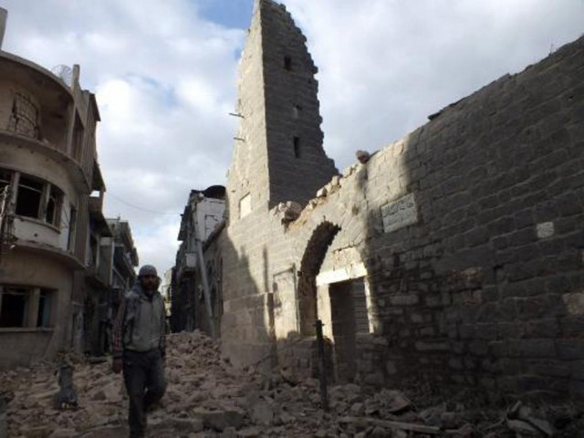 a man walks past a damaged mosque in the besieged area of homs january 30 2014 photo reuters a man walks past a damaged mosque in the besieged area of homs january 30 2014 photo reuters