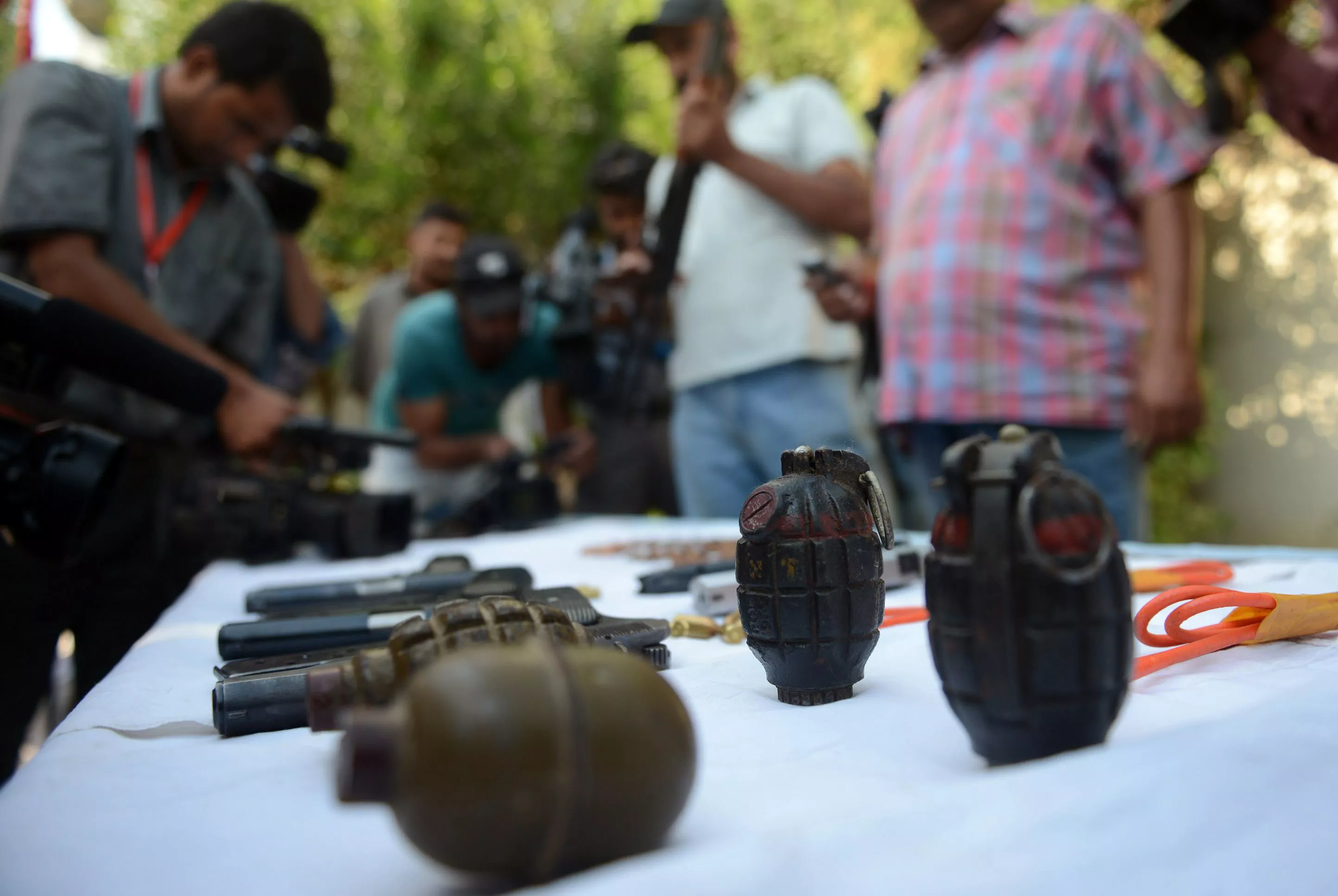 police officials along with the bomb disposal squad reached the site immediately after the incident and defused the grenade photo afp police officials along with the bomb disposal squad reached the site immediately after the incident and defused the grenade photo afp