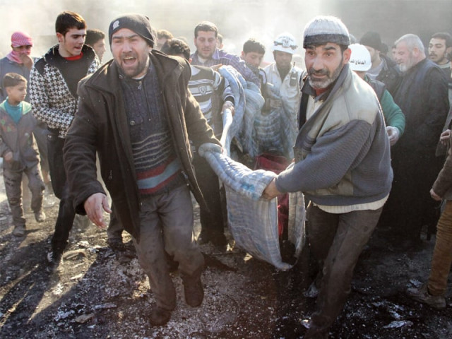 syrians rush victims from the site of a reported air strike in the tariq al bab district of the northern city of aleppo photo afp syrians rush victims from the site of a reported air strike in the tariq al bab district of the northern city of aleppo photo afp