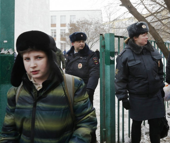 interior ministry members evacuate people after an armed student took hostages at a high school on the outskirts of moscow february 3 2014 photo reuters interior ministry members evacuate people after an armed student took hostages at a high school on the outskirts of moscow february 3 2014 photo reuters