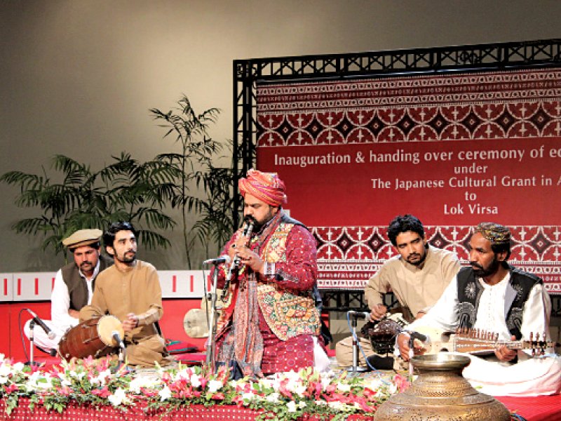 baloch and sindhi folk artists perform at the handing over ceremony of digital equipment photo express