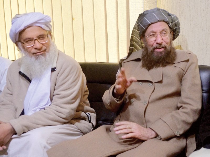 maulana abdul aziz and maulana samiul haq sit together after their meeting in islamabad photo afp