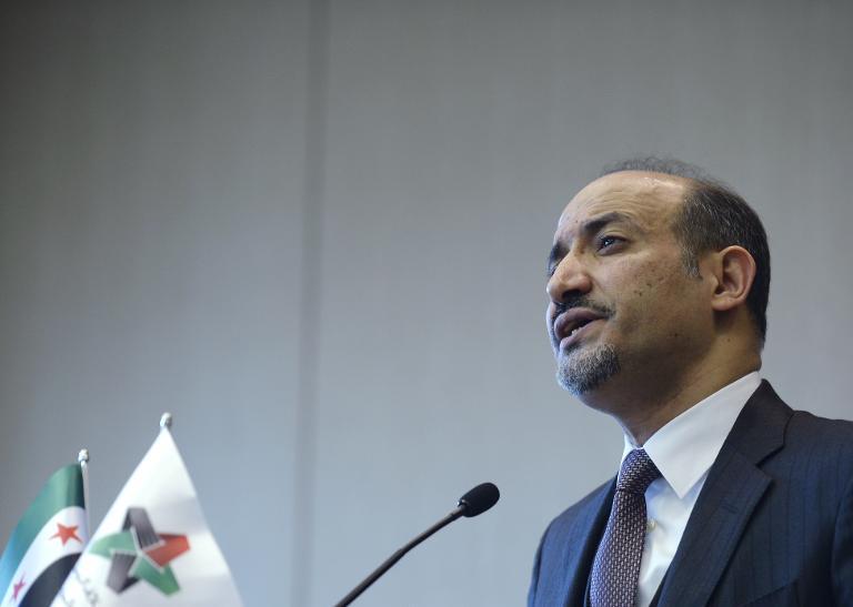 syrian national coalition snc leader ahmad jarba speaks during a press briefing on the peace talks on january 31 2014 in geneva photo afp