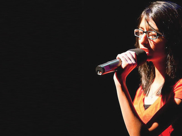 cyra asli during a concert cyra asli during a concert