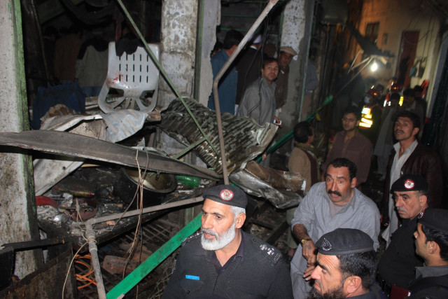police and rescue officials at the site of the blast in qissa khwani on tuesday photo mohammad iqbal express police and rescue officials at the site of the blast in qissa khwani on tuesday photo mohammad iqbal express