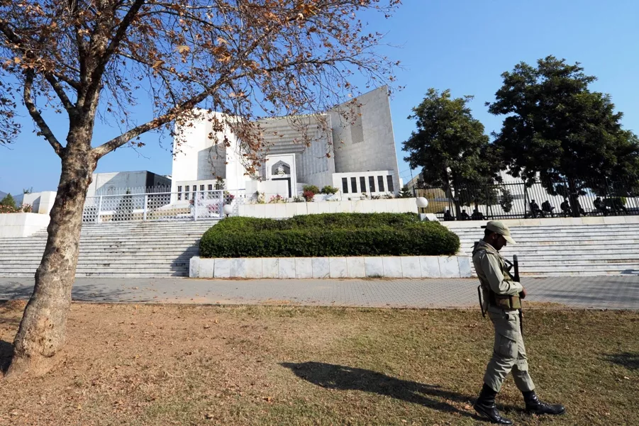 a paramilitary soldier patrols outside the supreme court building during a hearing in islamabad on december 28 2011 photo afp a paramilitary soldier patrols outside the supreme court building during a hearing in islamabad on december 28 2011 photo afp