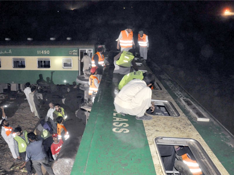 rescuers look for victims from the broken windows of night coach express photo express