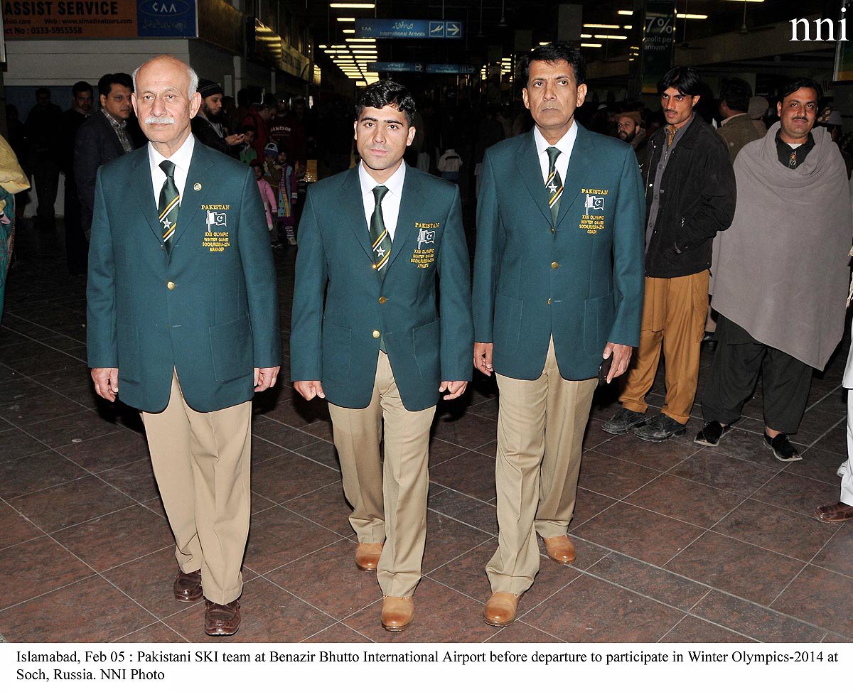 mohammad karim c wears the national blazer at the airport before flying to sochi russia photo nni