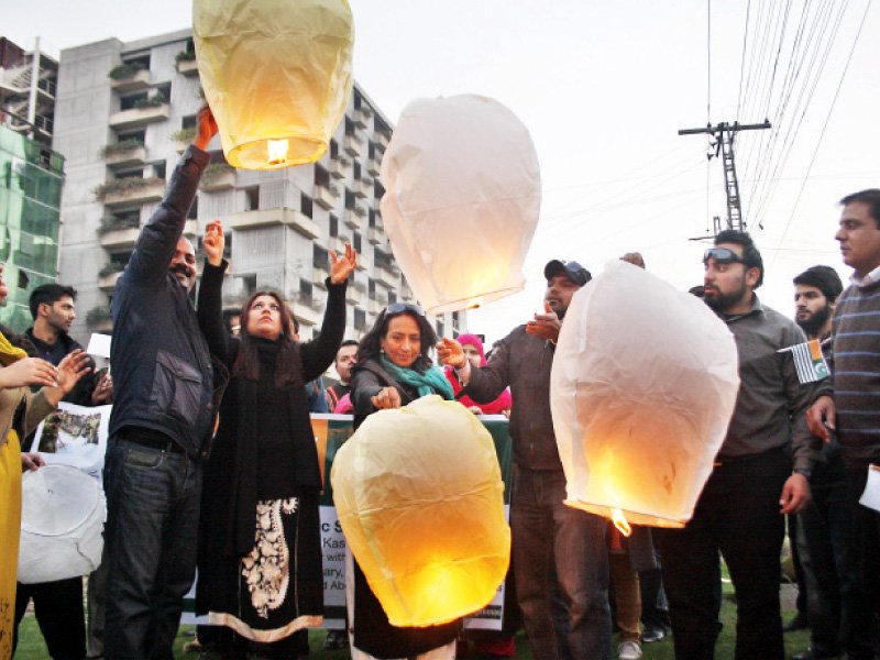 pakistan tehreek i insaaf workers float lanterns into the sky at liberty chowk photo abid nawaz shafiq malik express