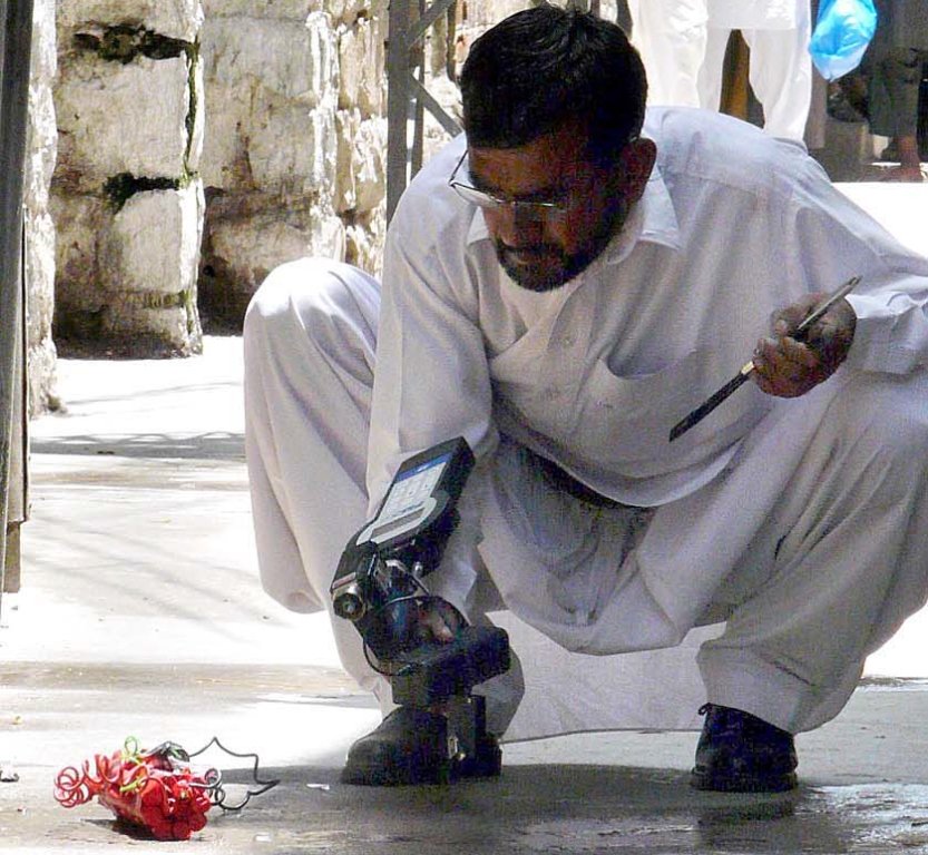 a bomb disposal squad official defusing a bomb photo app