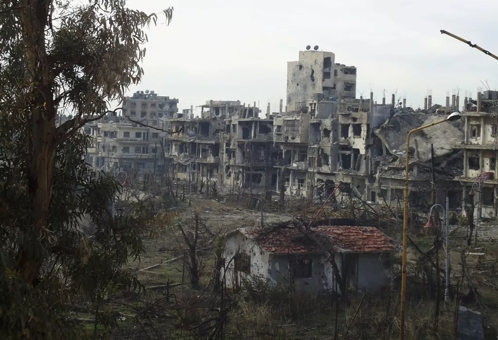 damaged buildings are pictured in the besieged area of homs picture taken december 24 2013 photo reuters damaged buildings are pictured in the besieged area of homs picture taken december 24 2013 photo reuters