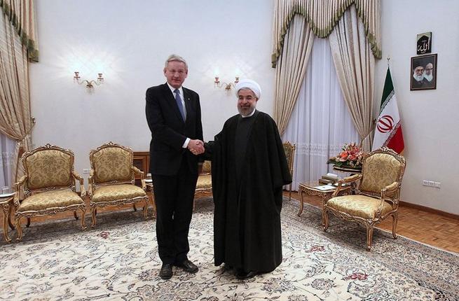 a picture released by the iranian presidency shows the islamic republic 039 s president hassan rouhani shaking hands with sweden 039 s foreign minister photo afp