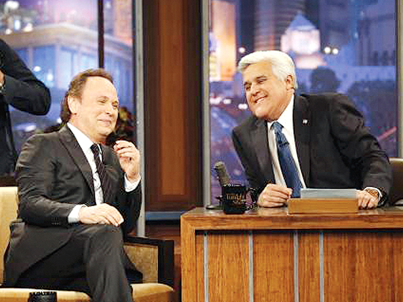 host jay leno is pictured with actor billy crystal during a commercial break while taping his last episode of the tonight show photo file