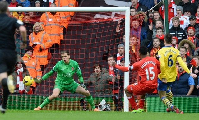liverpool 039 s english striker daniel sturridge 2nd r scores their fourth goal past arsenal 039 s polish goalkeeper wojciech szczesny l during the english premier league football match between liverpool and arsenal at anfield in liverpool northwest england on february 8 2014 photo afp