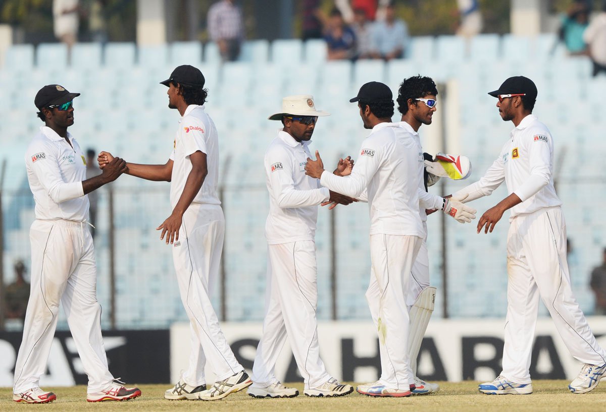 sri lankan and bangladeshi players shake hands after the match ended on saturday photo afp