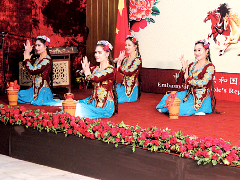 folk performers presenting traditional dances at the celebration photo express