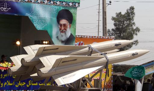 a military truck carries shalamcheh missiles in a military parade in tehran on september 22 2013 photo afp file