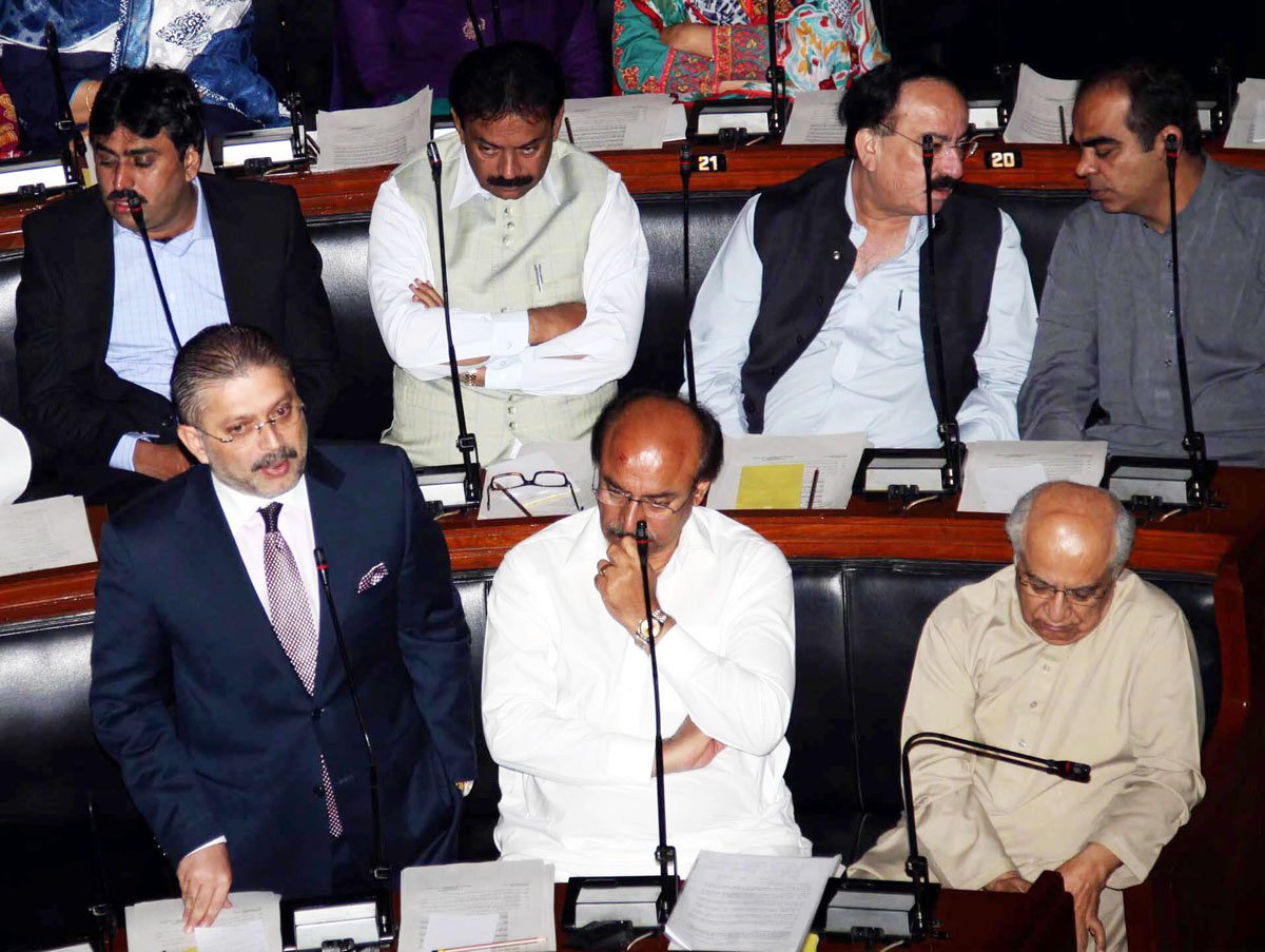 sindh information minister sharjeel memon l speaks in the house flanked by sindh minister for education nisar khuhro c photo rashid ajmeri express