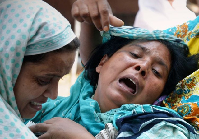 christians mourn the death of relatives at all saints church in peshawar on september 24 2013 photo afp christians mourn the death of relatives at all saints church in peshawar on september 24 2013 photo afp