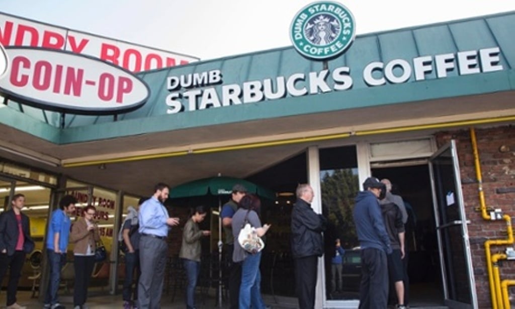 people line up outside dumb starbucks a parody store of the starbucks coffee chain in los angeles photo reuters