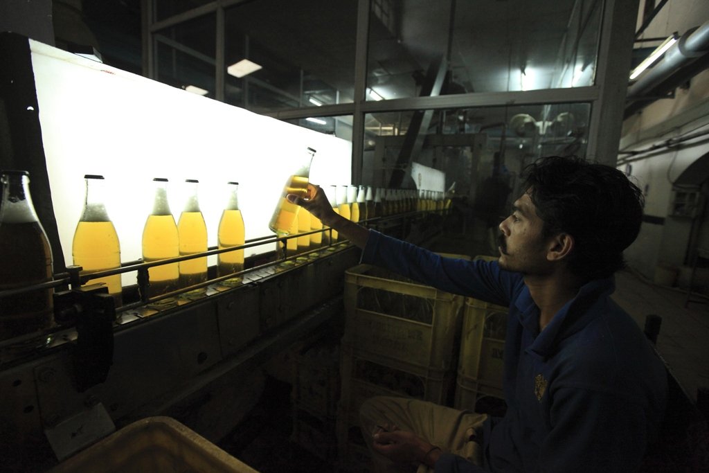 a worker at murree brewery checks the quality of bottles at the factory in rawalpindi november 10 2012 photo reuters