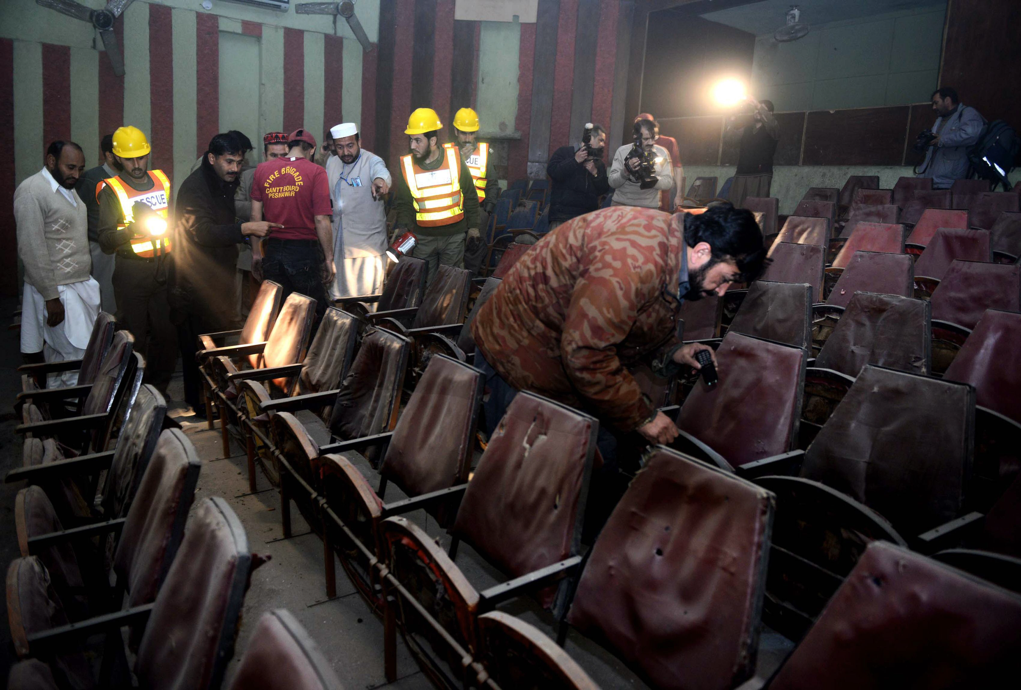 volunteers and rsecurity officials investigate the peshawar cinema after the attack photo afp