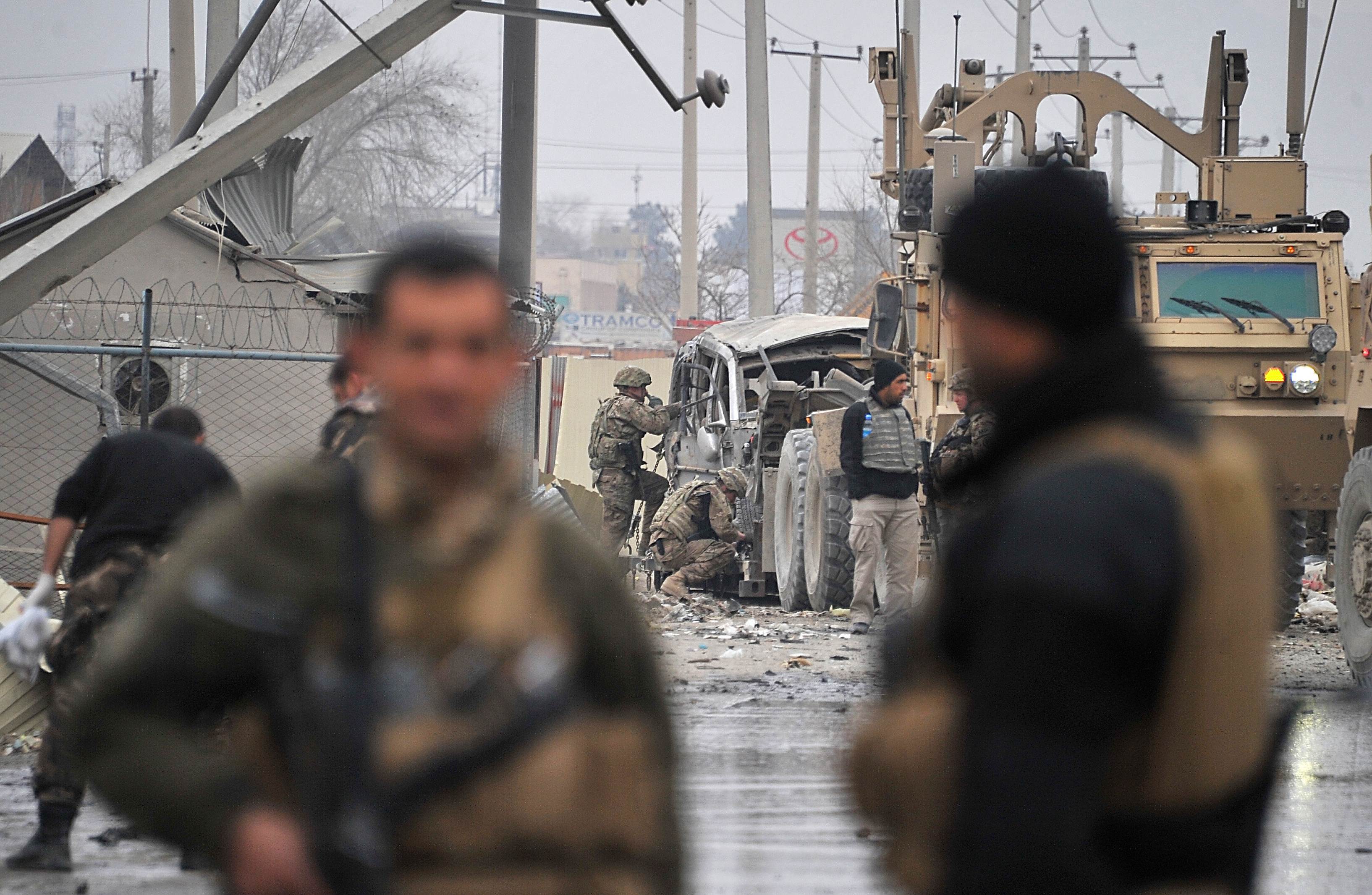 afghan security forces and nato led international security assistance force isaf personnel gt photo afp