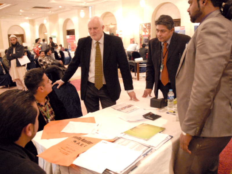 australian high commissioner peter heyward and aeo chief executive officer saad mehmood talk to students left who obtain information about education in australia at the expo photo express