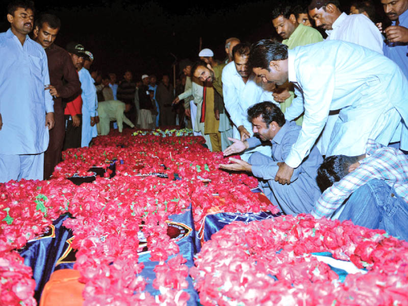 funeral prayers for the 13 policemen killed in thursday s attack were held at the special security unit s head office later the bodies were taken to the officers native towns for burial photo afp