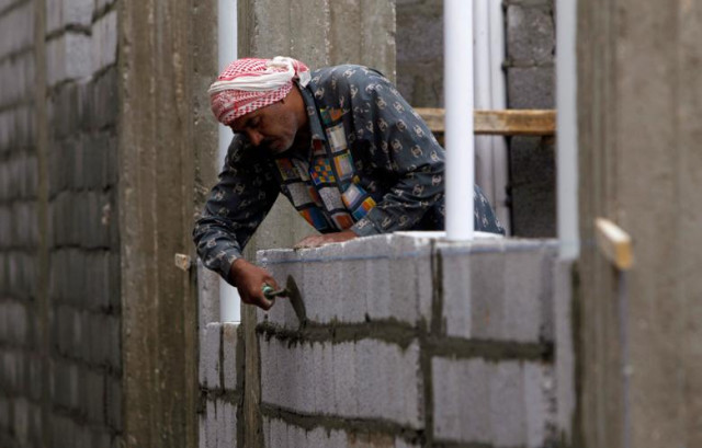 a labourer works at a construction site in riyadh photo reuters a labourer works at a construction site in riyadh photo reuters