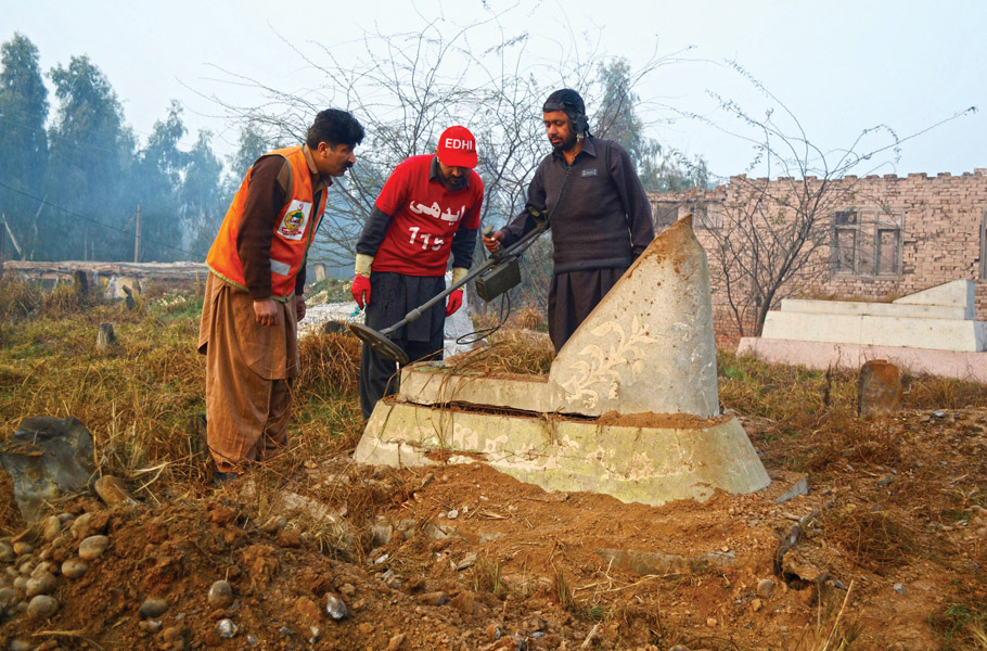 bomb disposal squad officials investigate the site of the explosion on charsadda road photo muhammad iqbal express