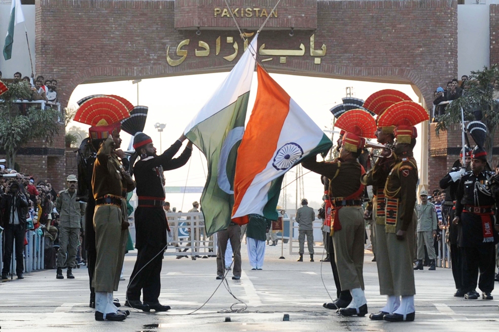 pakistani rangers and indian border security force personnel perform the daily retreat ceremony on the india pakistan border at wagah on january 8 2012 photo afp